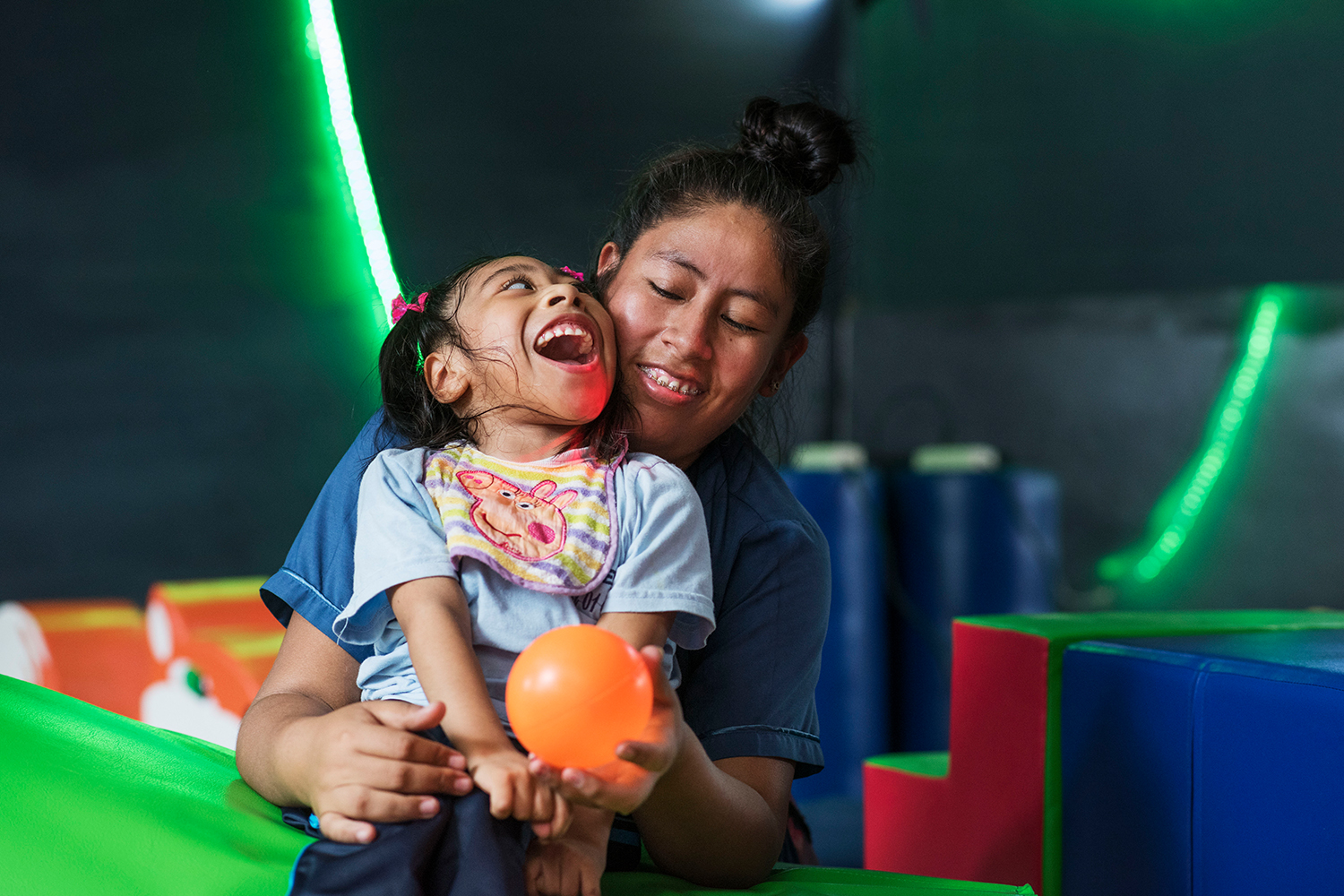 A therapist and child in the sensory stimulation room