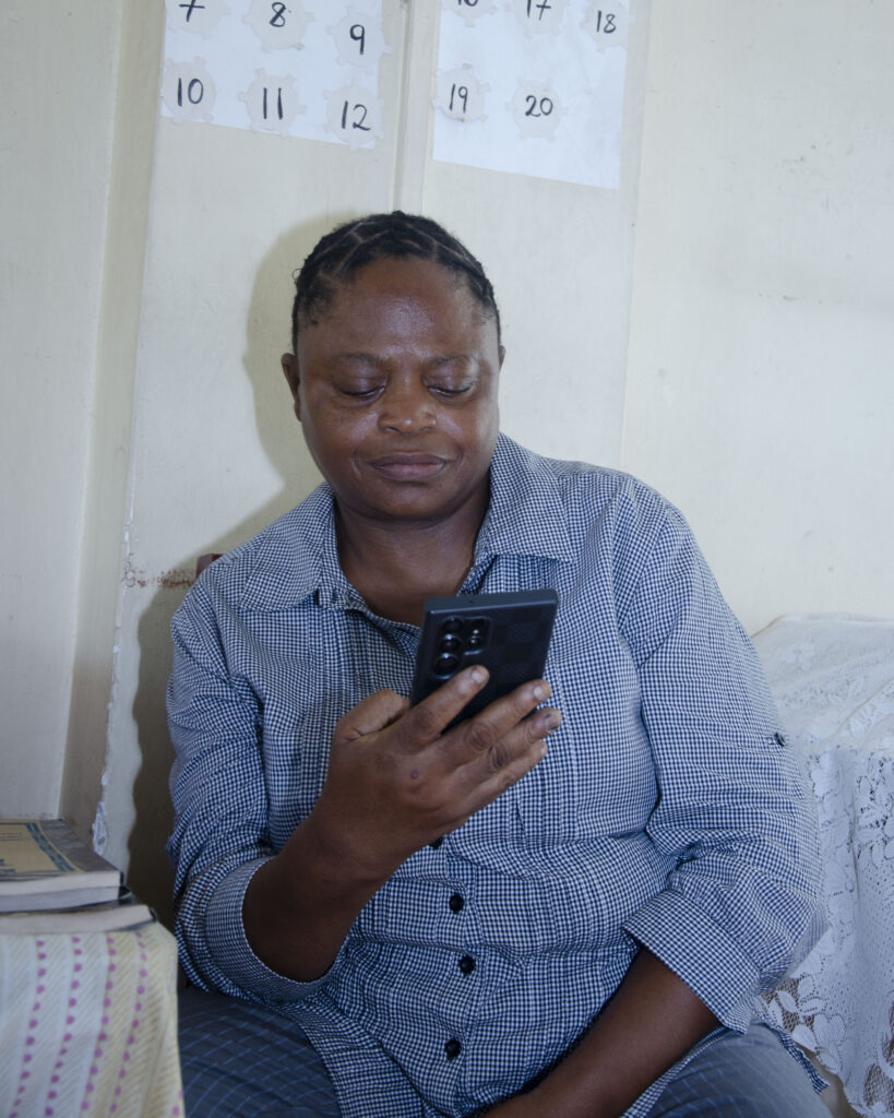 Adrian sat in her classroom, looking at her phone. 